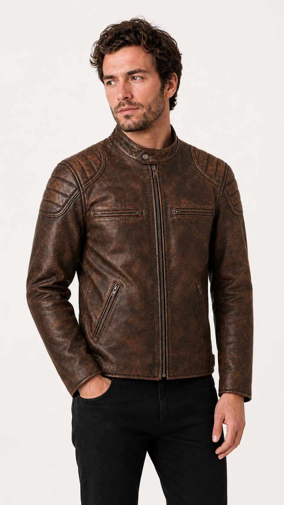 British model looking to the side in the distressed brown biker jacket