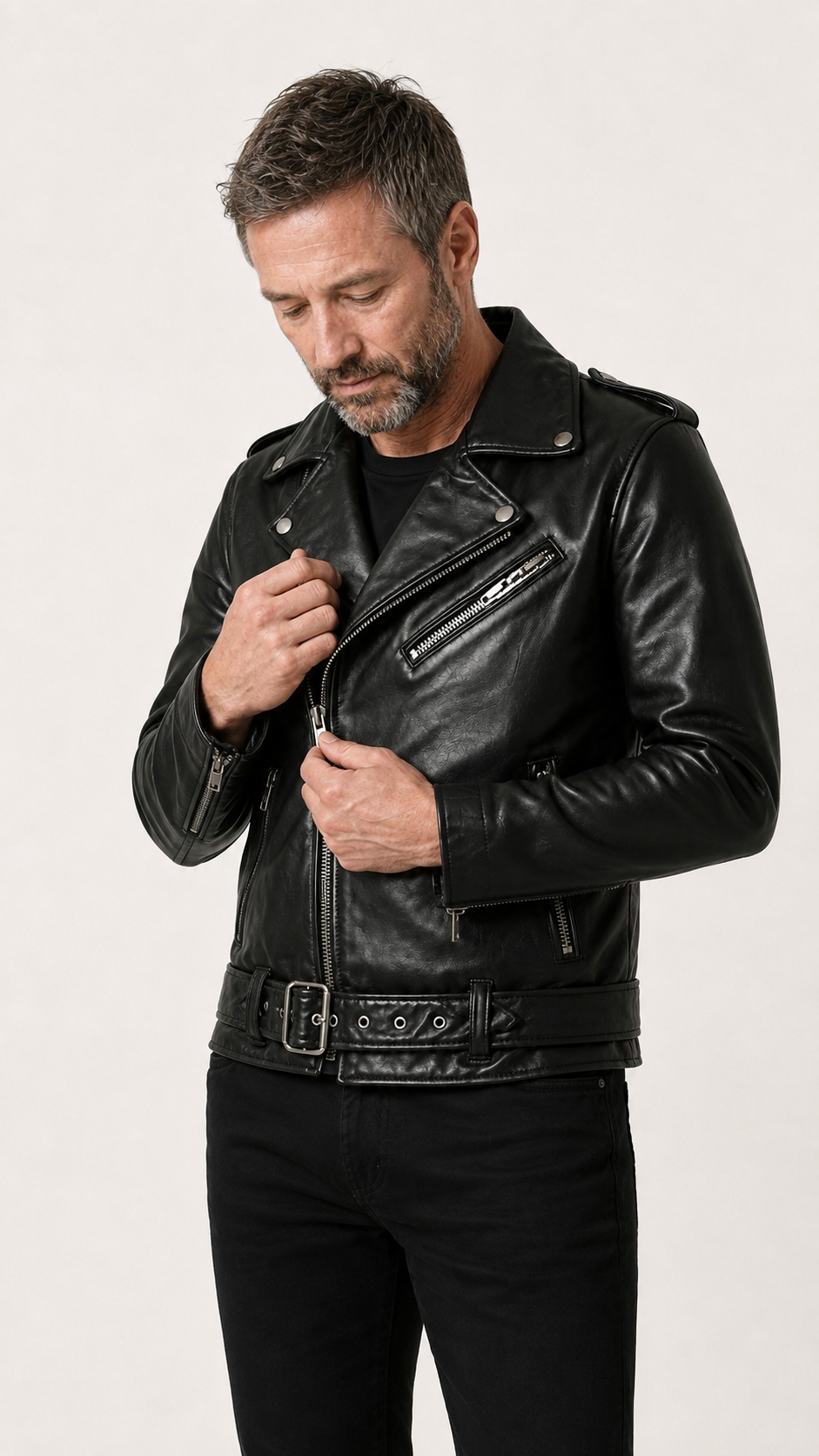 Man fastening the black double rider biker jacket — British model