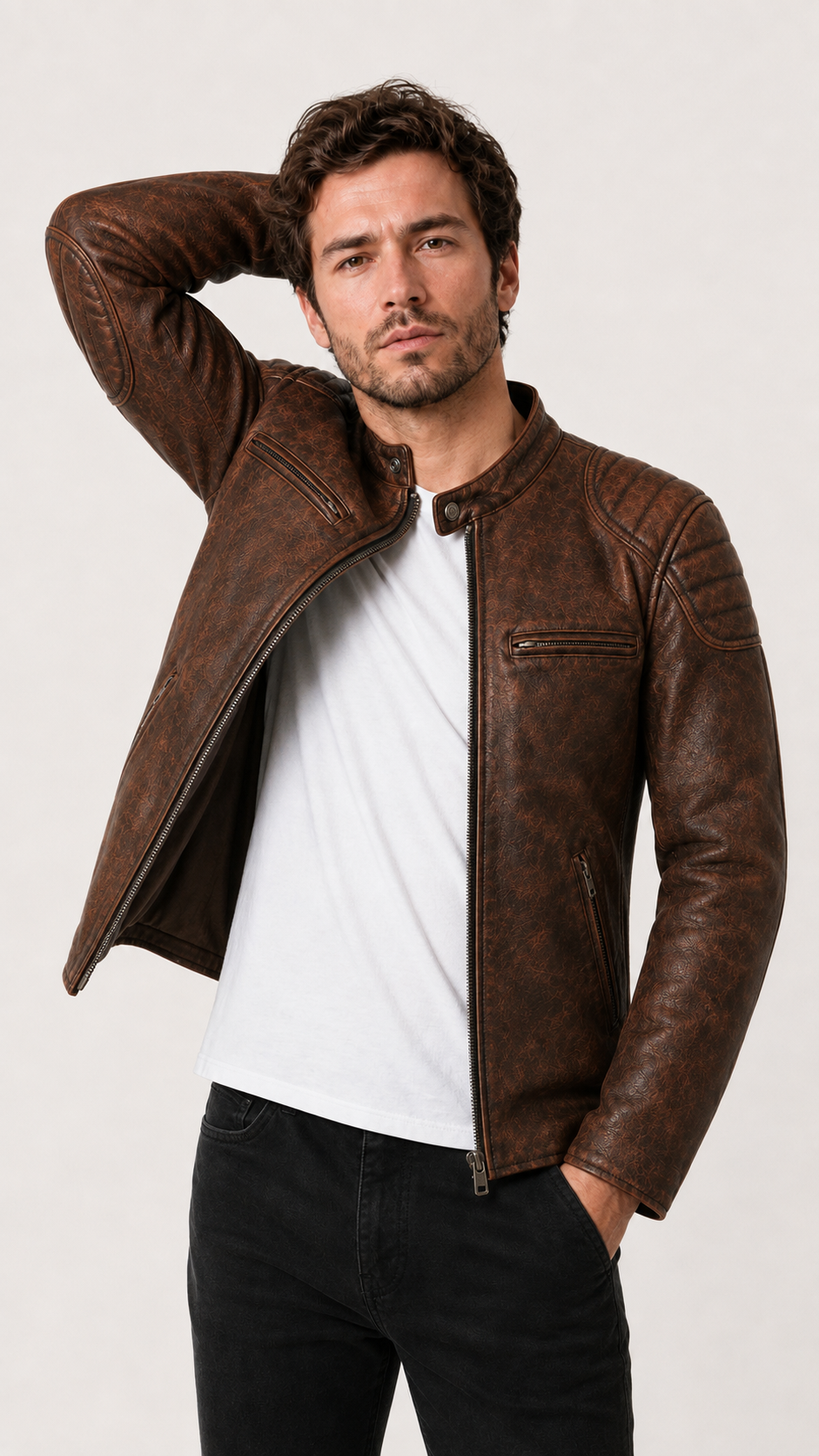 Man raising his arm in the distressed brown leather biker jacket — British model