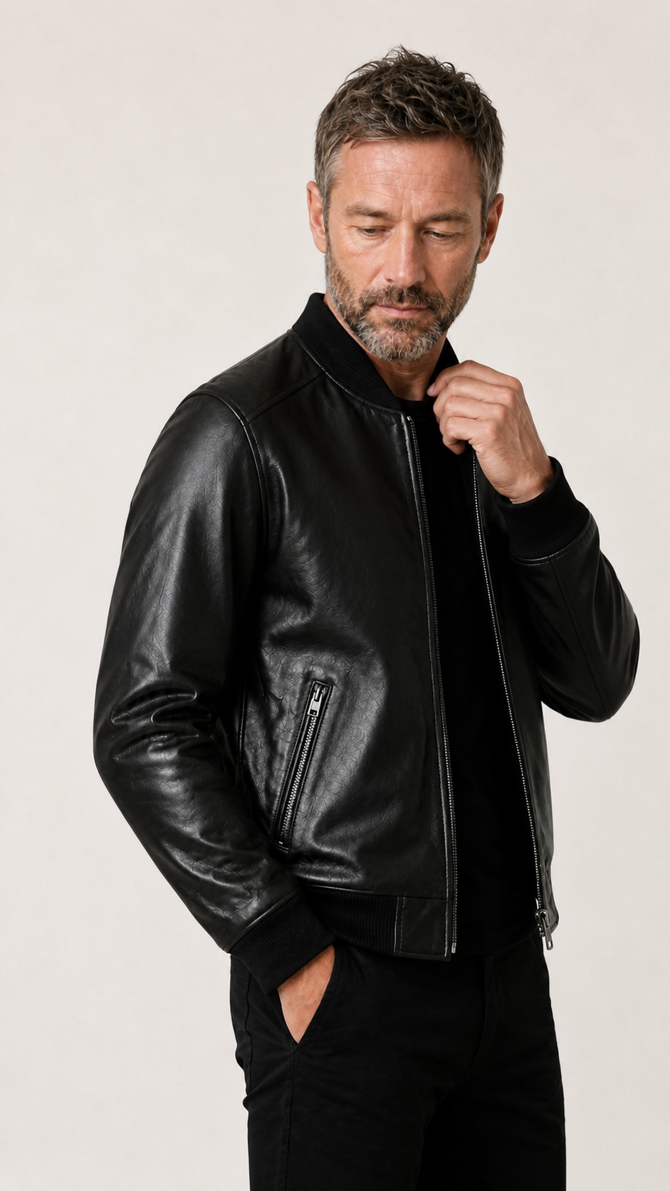 Side view of a man in the black sheepskin bomber jacket — British model